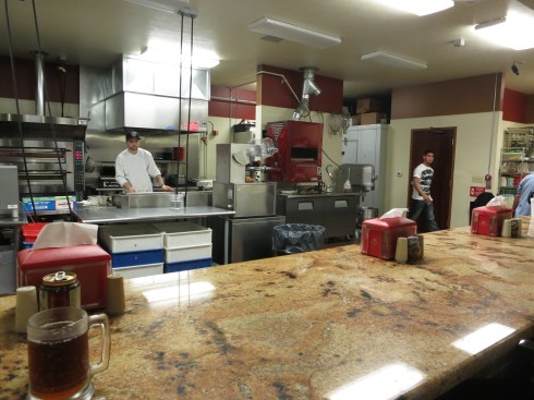 A view into the kitchen at Borgata. The open kitchen really makes the space feel open and welcoming.