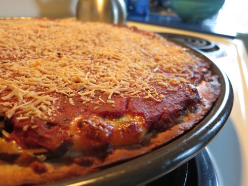 A properly assembled Chicago-style pizza.  Sauce on top!